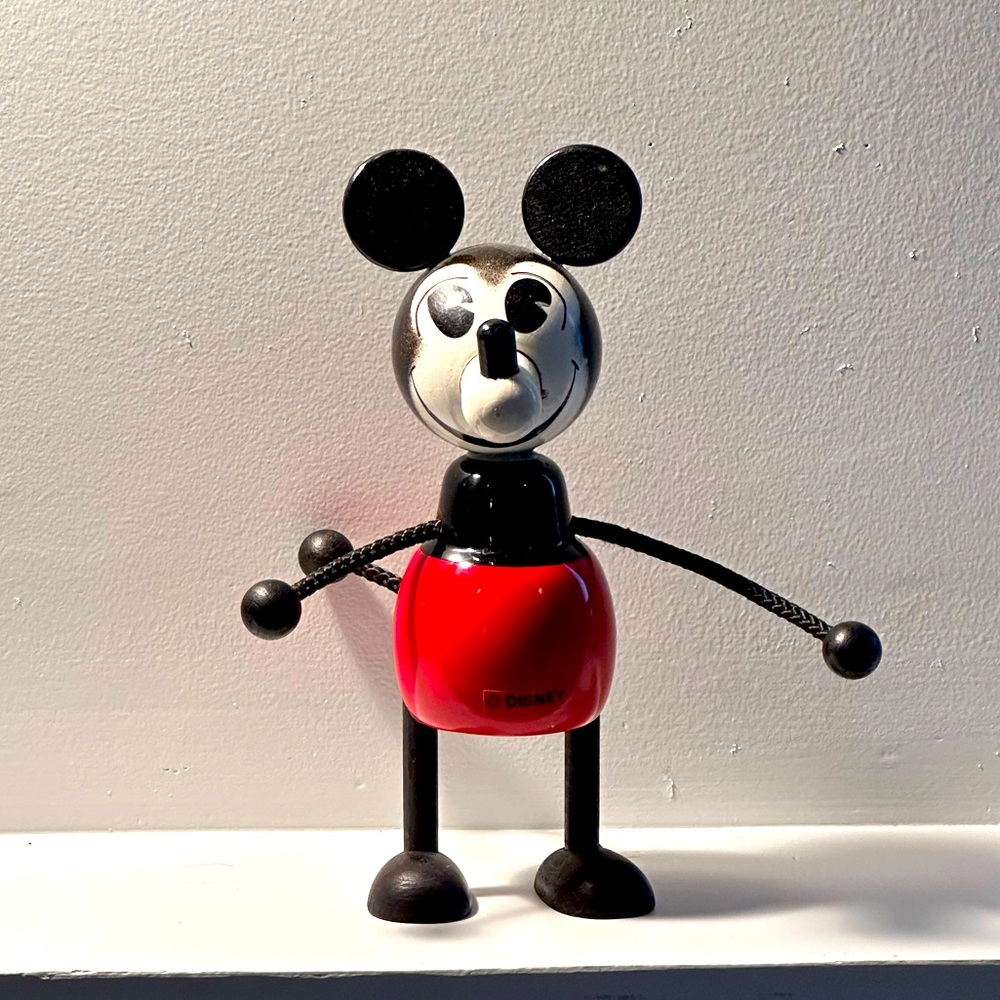 Precious and absolutely iconic, Classic Mickey wooden piggy bank